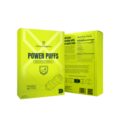 Yellow cereal box labeled 'Power Puffs' with nutritional information on a white background. Peanut Butter flavor