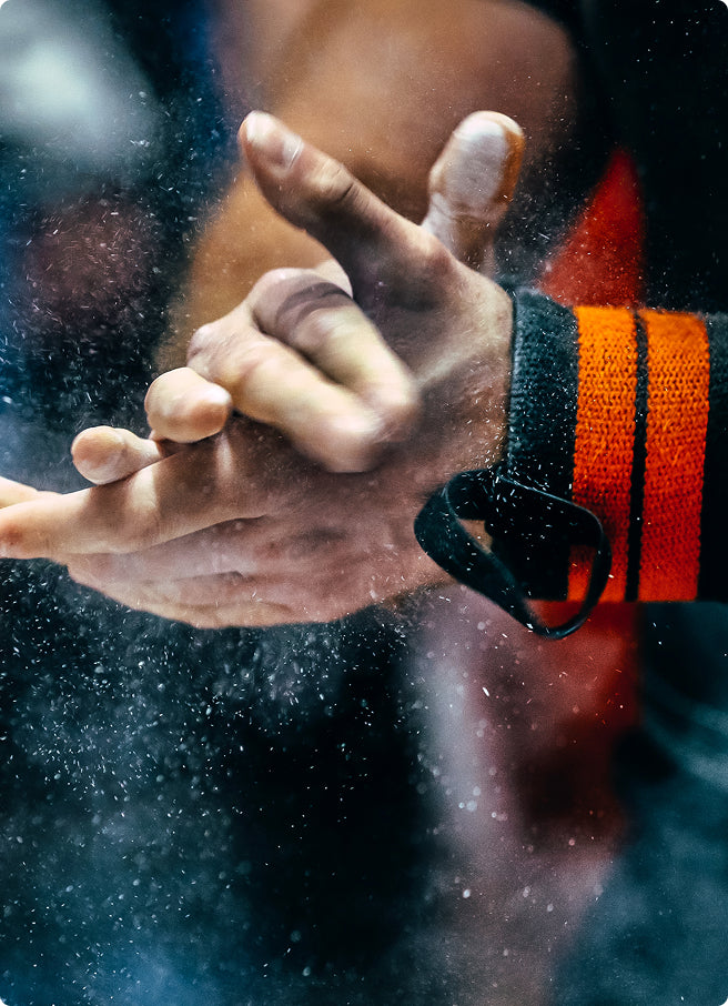Hand with chalk powder on a blurred background